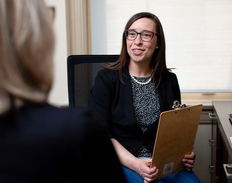 a community health professional talking with a patient