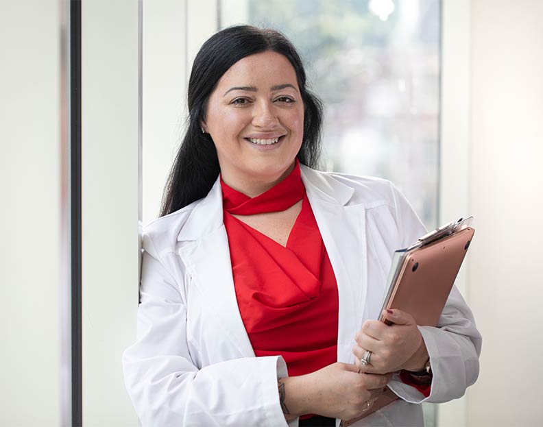 a nursing student holding a clipboard